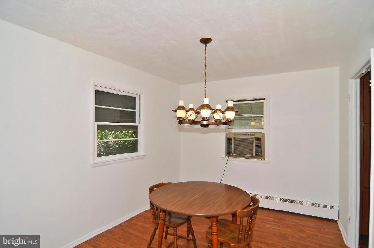 5729 Oakland Road Halethorpe, MD 21227 - Photo 6 of 18 a view of a dining room with furniture and chandelier