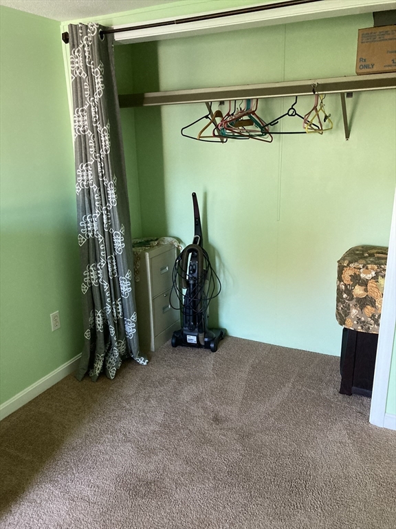 557 Southwest Cutoff, Unit 17 Worcester, MA 01607 - Photo 11 of 19 a view of a room with gym equipment