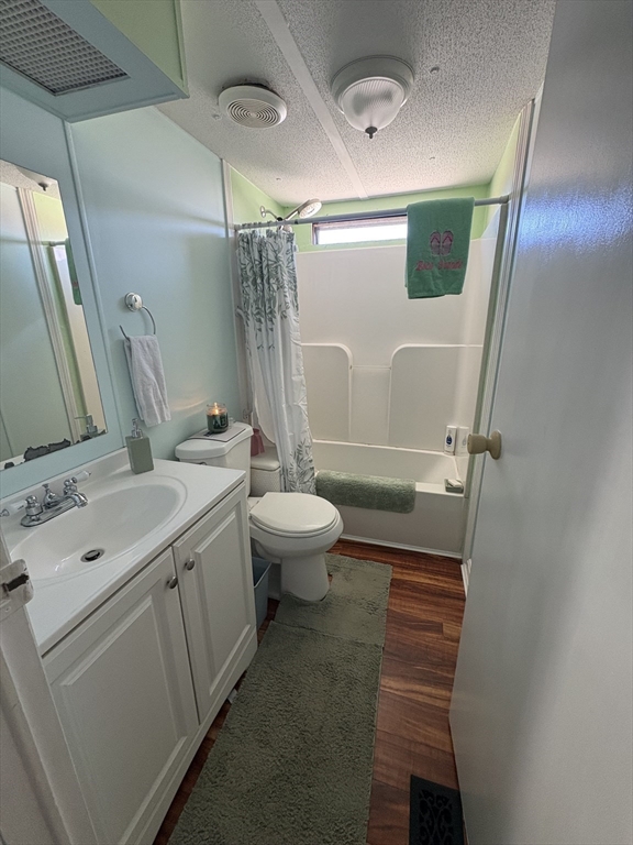557 Southwest Cutoff, Unit 17 Worcester, MA 01607 - Photo 13 of 19 a bathroom with a sink mirror vanity and toilet