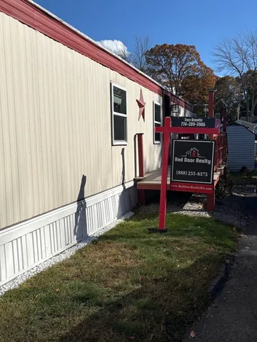 a view of a back yard with a wooden fence