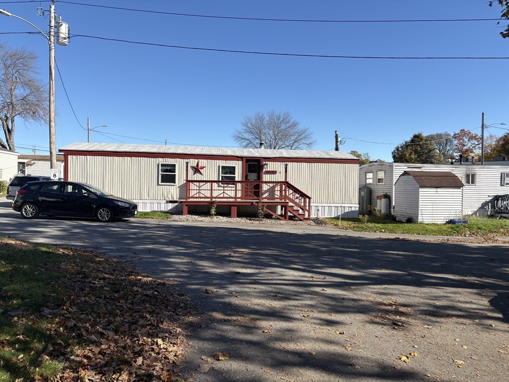 557 Southwest Cutoff, Unit 17 Worcester, MA 01607 - Photo 3 of 19 a view of a house with a yard