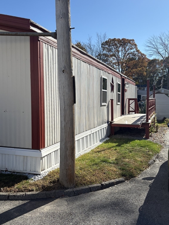 557 Southwest Cutoff, Unit 17 Worcester, MA 01607 - Photo 4 of 19 a view of a house with a yard fire pit and outdoor space