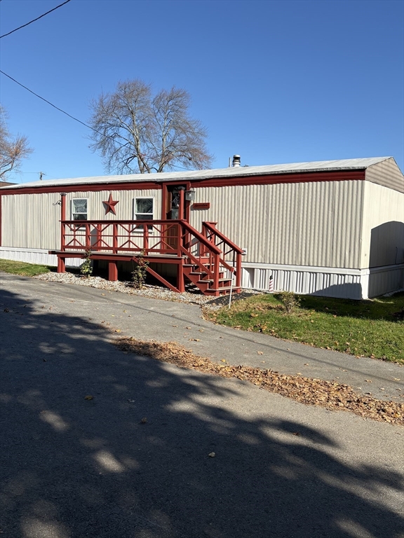 557 Southwest Cutoff, Unit 17 Worcester, MA 01607 - Photo 5 of 19 a view of a house with a yard