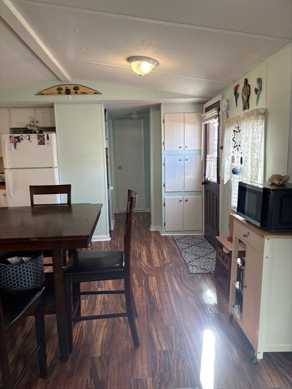 557 Southwest Cutoff, Unit 17 Worcester, MA 01607 - Photo 7 of 19 a view of a workspace with furniture and wooden floor