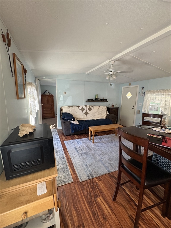 557 Southwest Cutoff, Unit 17 Worcester, MA 01607 - Photo 8 of 19 a living room with furniture and a wooden floor