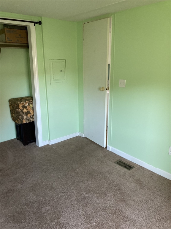 557 Southwest Cutoff, Unit 17 Worcester, MA 01607 - Photo 10 of 19 an empty room with cabinet