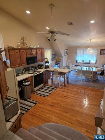 a large kitchen with lots of counter space and stainless steel appliances