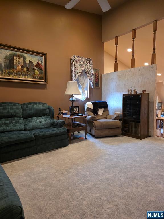 214 Newark Avenue, Unit 2 Lyndhurst, NJ 07071 - Photo 6 of 13 a living room with furniture a large window and a fireplace