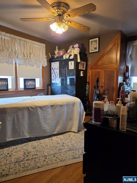 214 Newark Avenue, Unit 2 Lyndhurst, NJ 07071 - Photo 9 of 13 a living room with large couches and chandelier