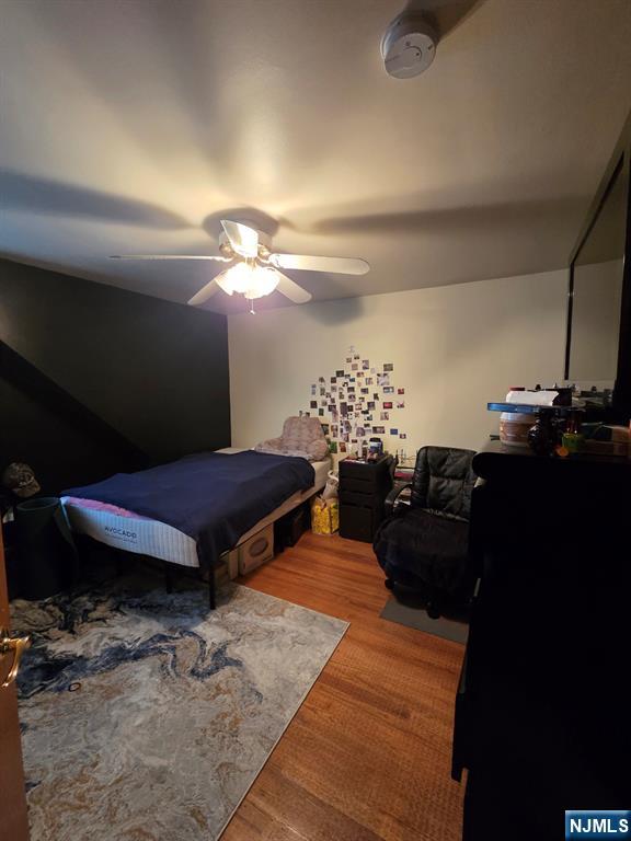 214 Newark Avenue, Unit 2 Lyndhurst, NJ 07071 - Photo 10 of 13 a living room with furniture a lamp and a rug