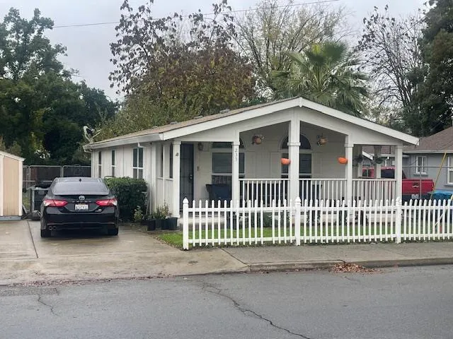 a view of a car parked in front of a house