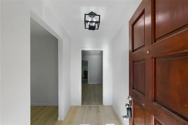 a view of hallway with livingroom