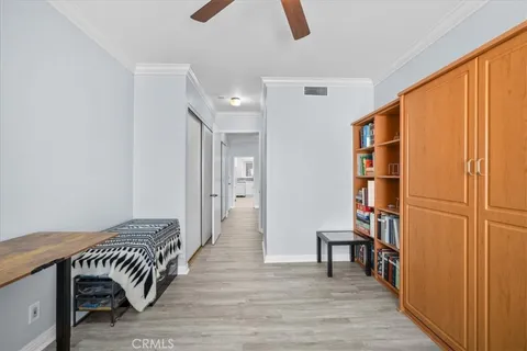 a view of bedroom with furniture and wooden floor
