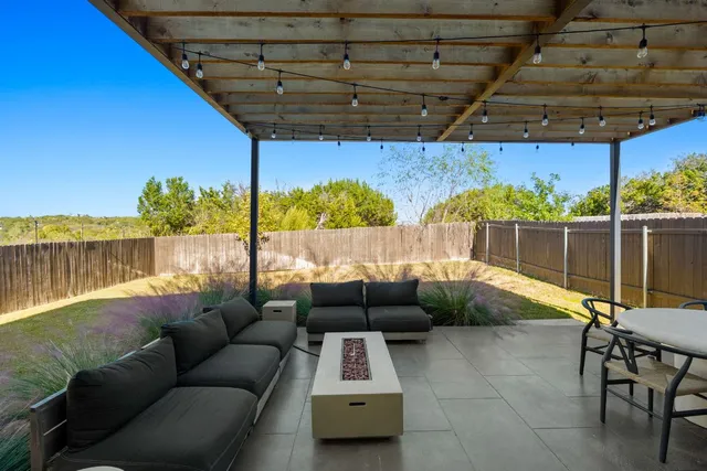 a bedroom with furniture and a flat screen tv
