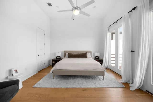 a view of a backyard with plants and a patio