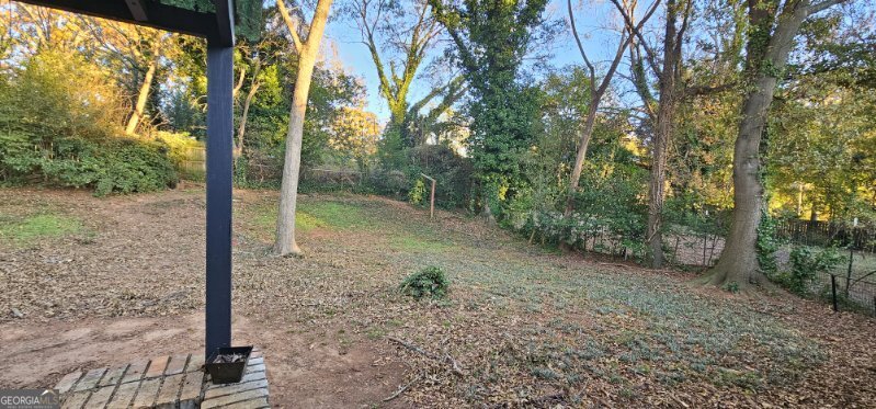 1976 Columbia Drive Decatur, GA 30032 - Photo 11 of 11 a backyard of a house with lots of green space