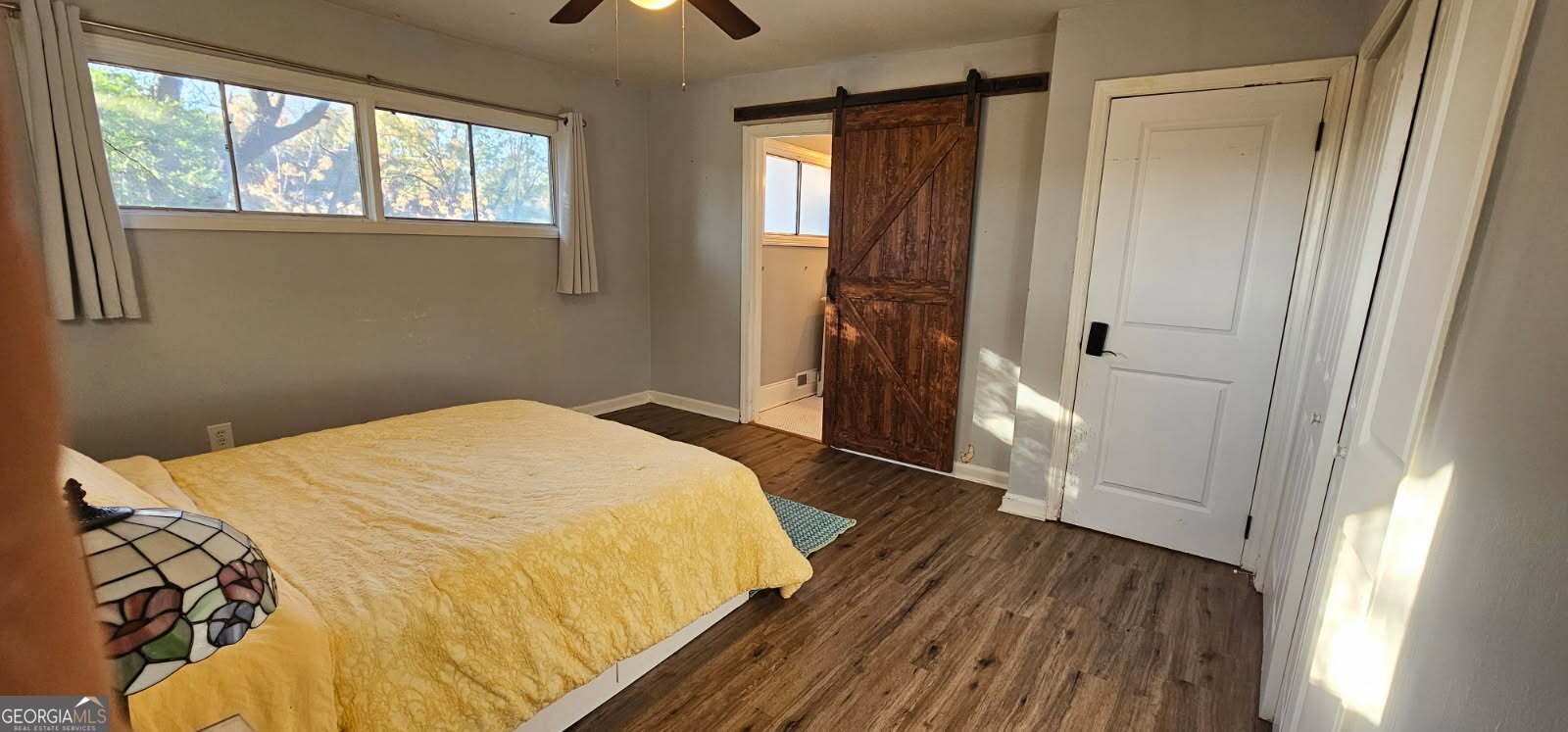 1976 Columbia Drive Decatur, GA 30032 - Photo 4 of 11 a bedroom with a bed and a window