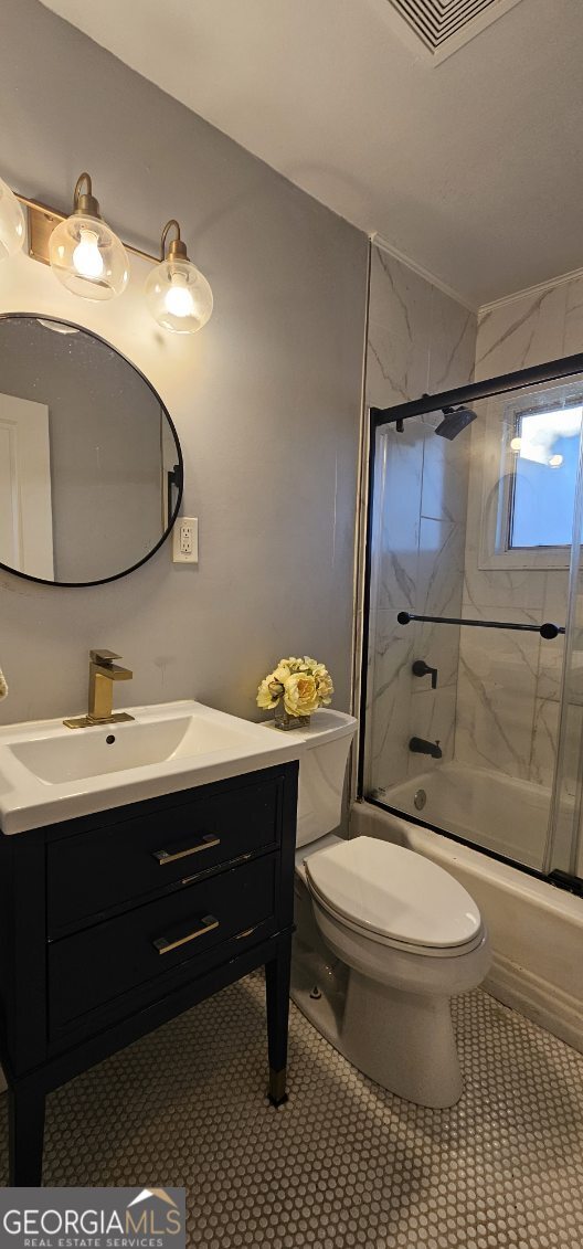 1976 Columbia Drive Decatur, GA 30032 - Photo 9 of 11 a bathroom with a sink toilet and mirror
