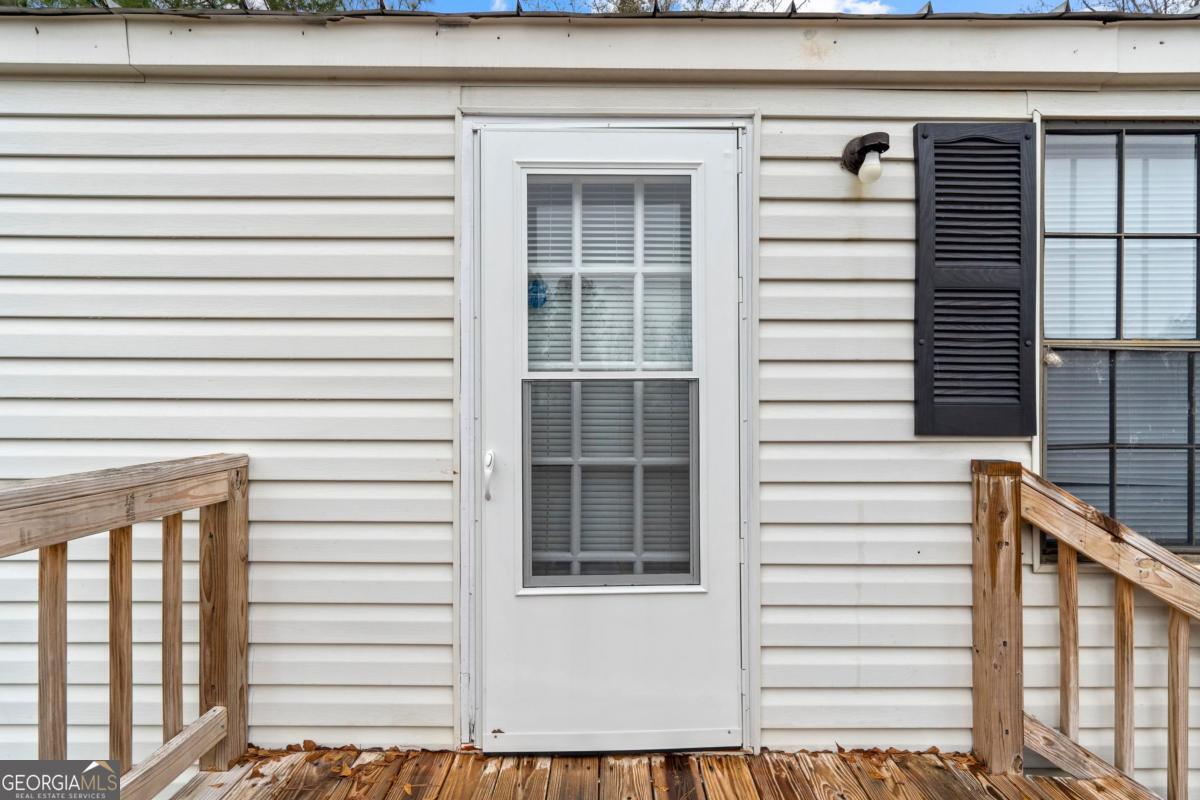 158 Thomas Field Road Southeast Milledgeville, GA 31061 - Photo 2 of 28 a view of a door and a window
