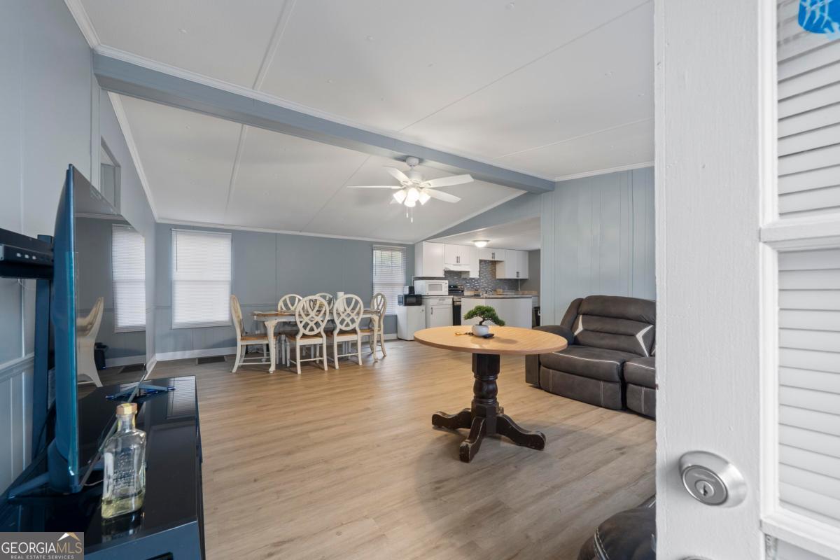 158 Thomas Field Road Southeast Milledgeville, GA 31061 - Photo 3 of 28 a living room with furniture and a table