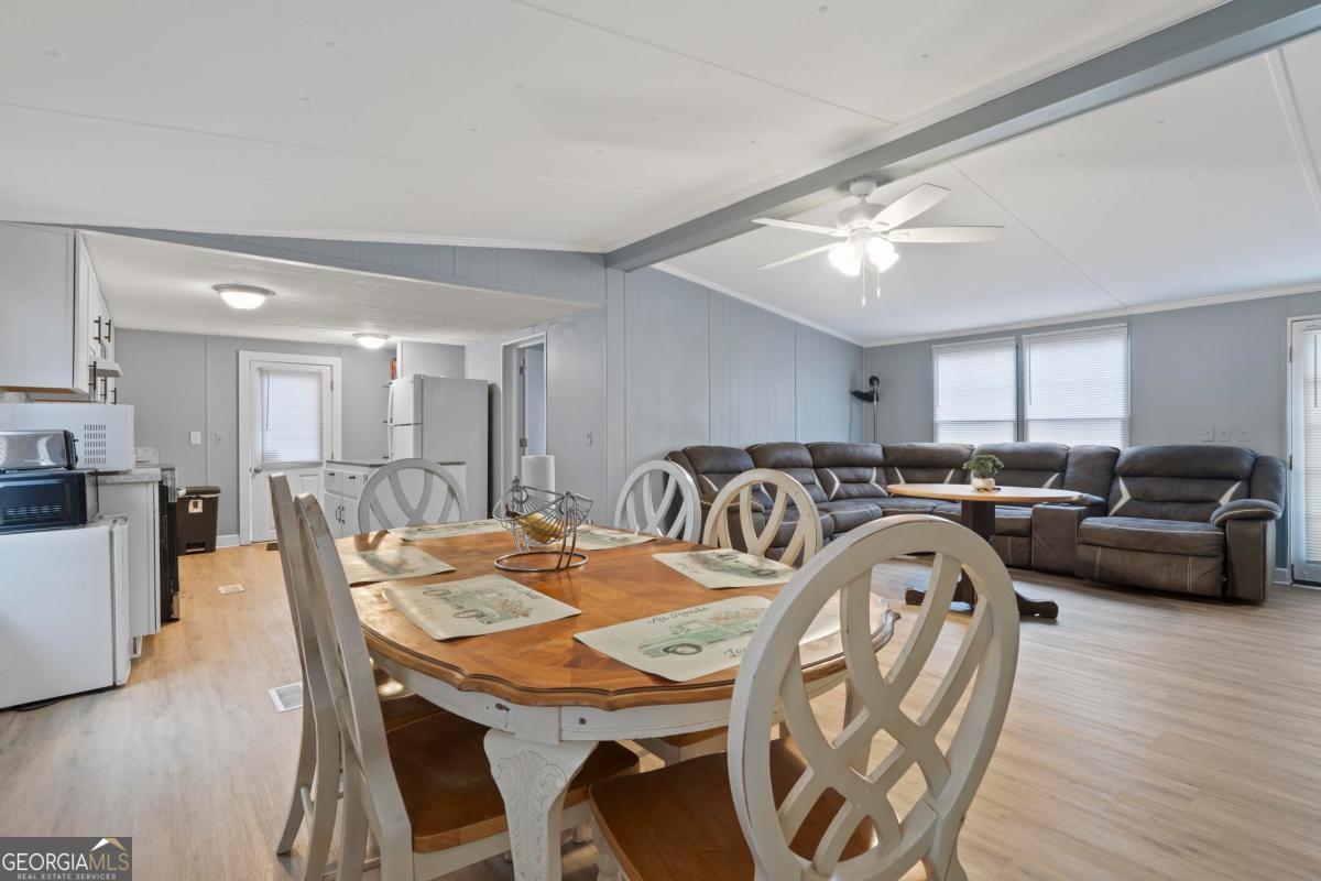 158 Thomas Field Road Southeast Milledgeville, GA 31061 - Photo 7 of 28 a view of a dining room with furniture