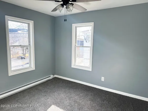 a bathroom with a toilet and a bathtub
