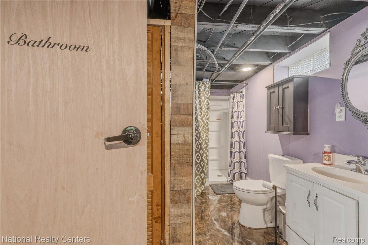 18051 Reed Street Melvindale, MI 48122 - Photo 28 of 35 Full bath featuring vanity and curtained shower in Basement.