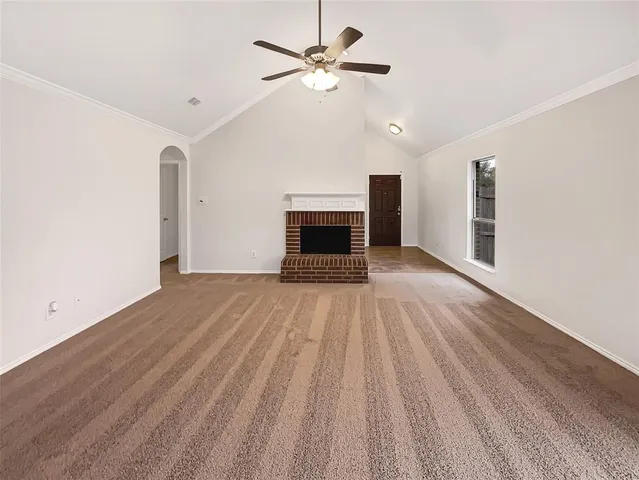 wooden floor fireplace and natural light in room
