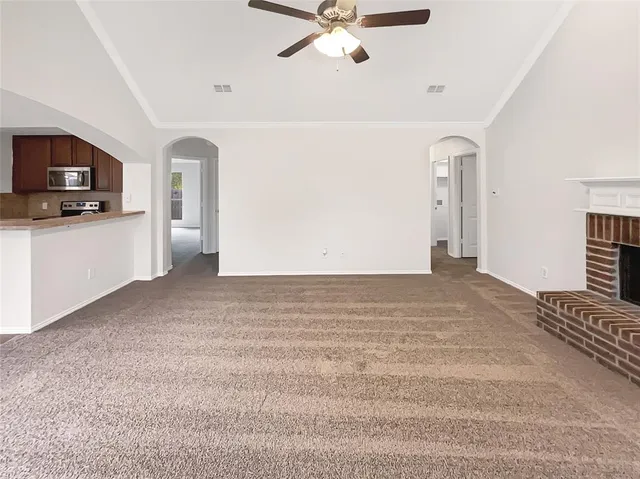 a view of a livingroom with a kitchen