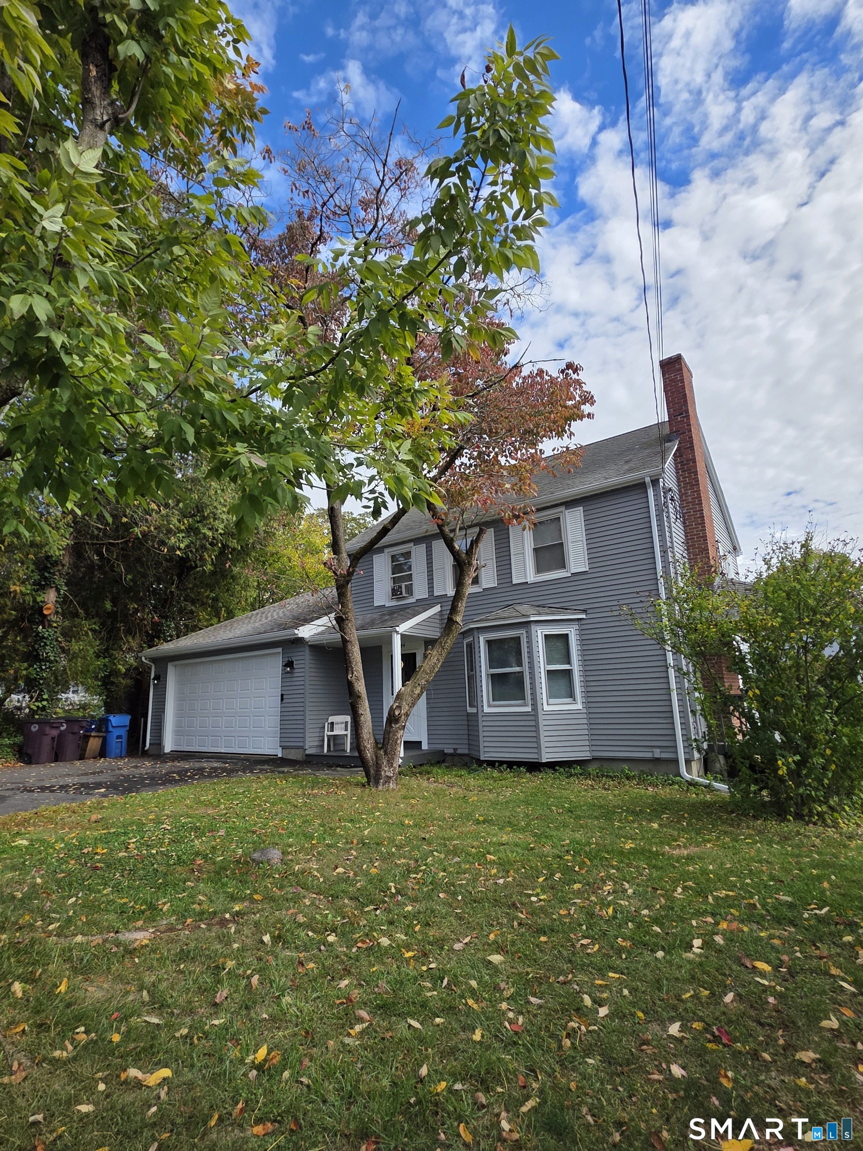44 Steele Street New Britain, CT 06052 - Photo 2 of 27 a front view of house with a garden