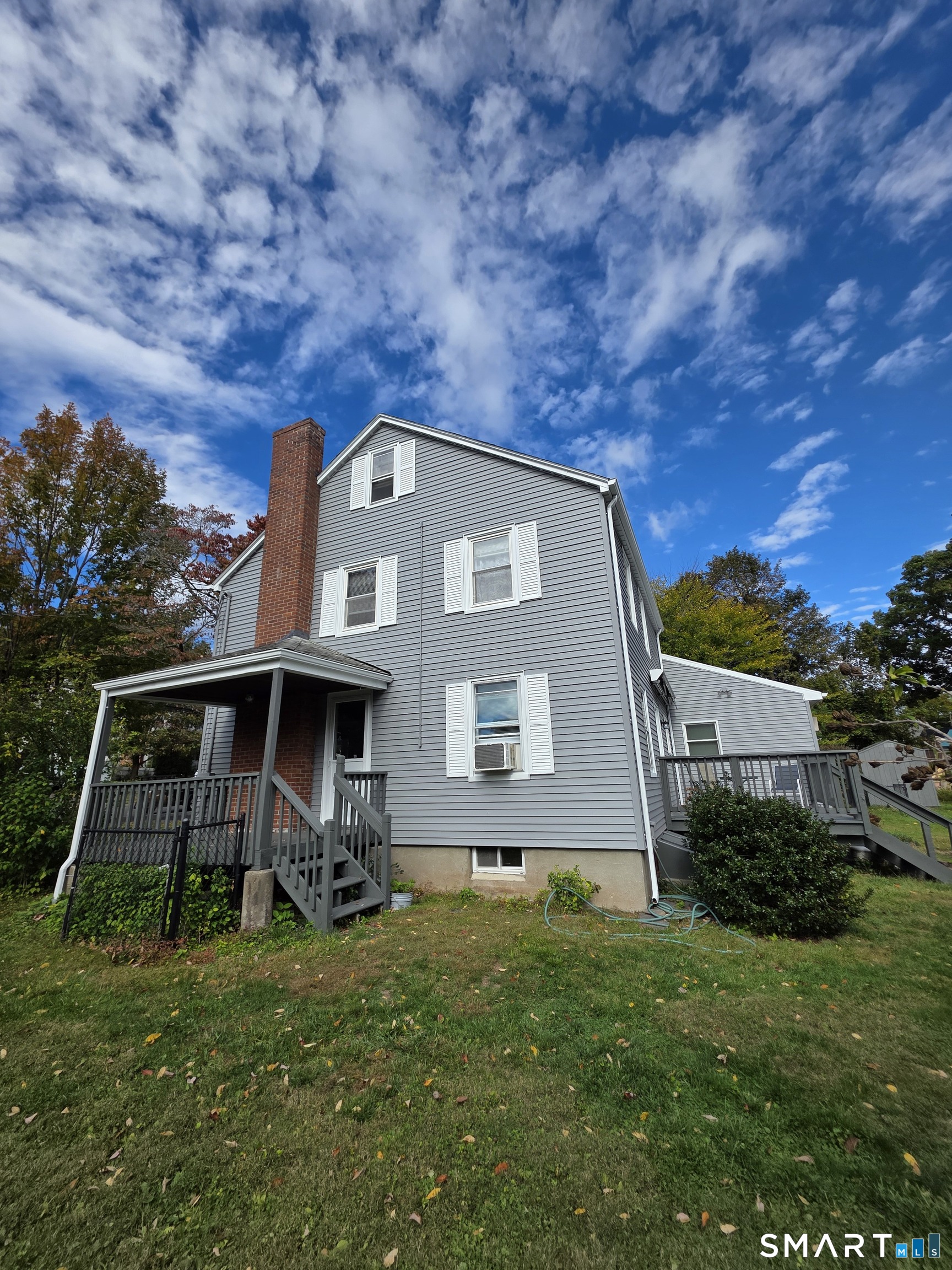 44 Steele Street New Britain, CT 06052 - Photo 3 of 27 a front view of a house with garden