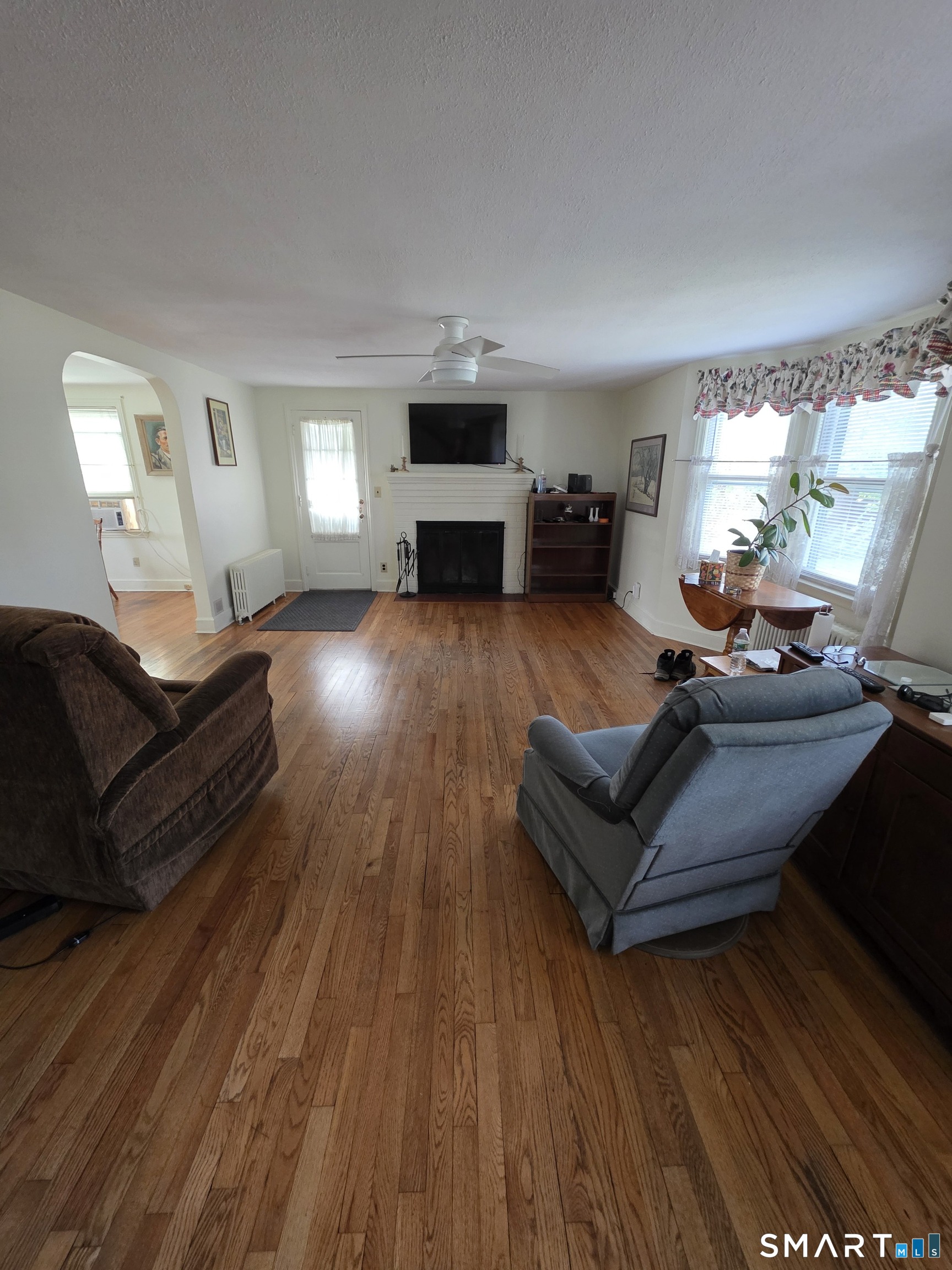 44 Steele Street New Britain, CT 06052 - Photo 8 of 27 a living room with furniture and a fireplace