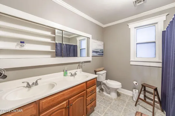 a bed room with furniture and a window
