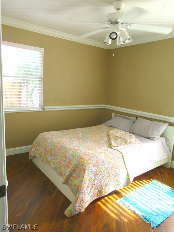 18415 Miller Road Fort Myers, FL 33967 - Photo 14 of 21 a bedroom with a bed and wooden floor