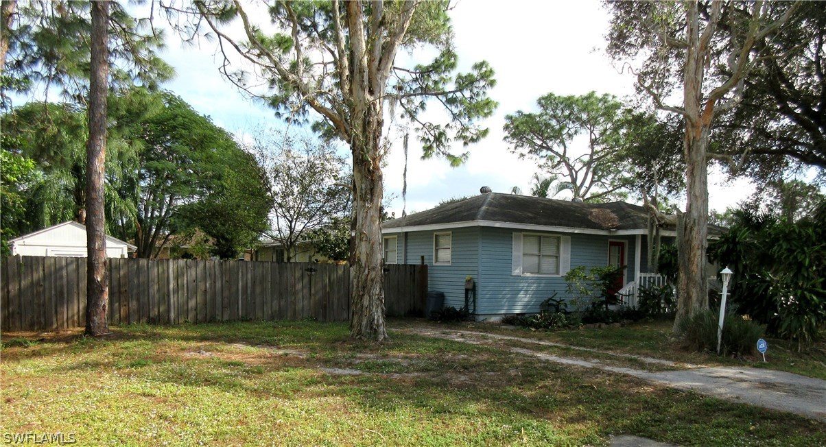 18415 Miller Road Fort Myers, FL 33967 - Photo 21 of 21 a house with trees in front of it