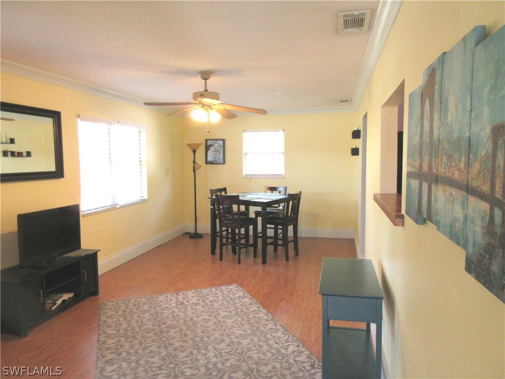18415 Miller Road Fort Myers, FL 33967 - Photo 4 of 21 a view of a livingroom with furniture window and wooden floor