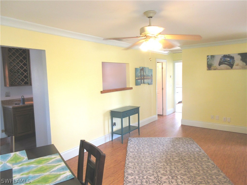 18415 Miller Road Fort Myers, FL 33967 - Photo 5 of 21 a bedroom with a bed and a table in it