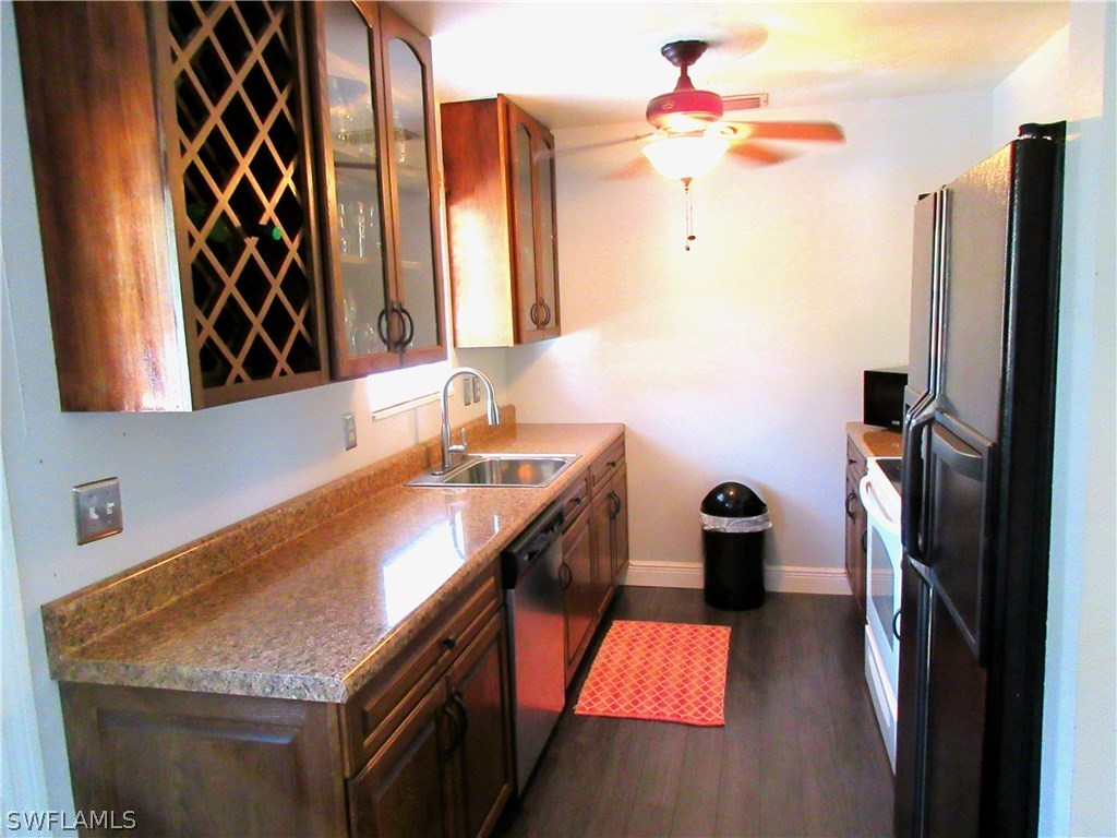18415 Miller Road Fort Myers, FL 33967 - Photo 6 of 21 a bathroom with a sink vanity and a mirror