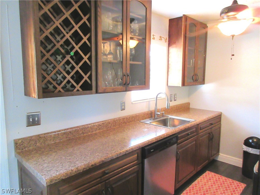 18415 Miller Road Fort Myers, FL 33967 - Photo 7 of 21 a kitchen with a sink a vanity and window
