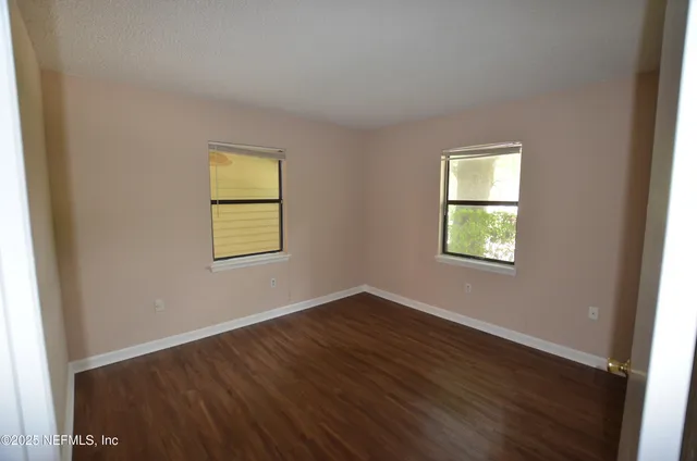 an empty room with windows