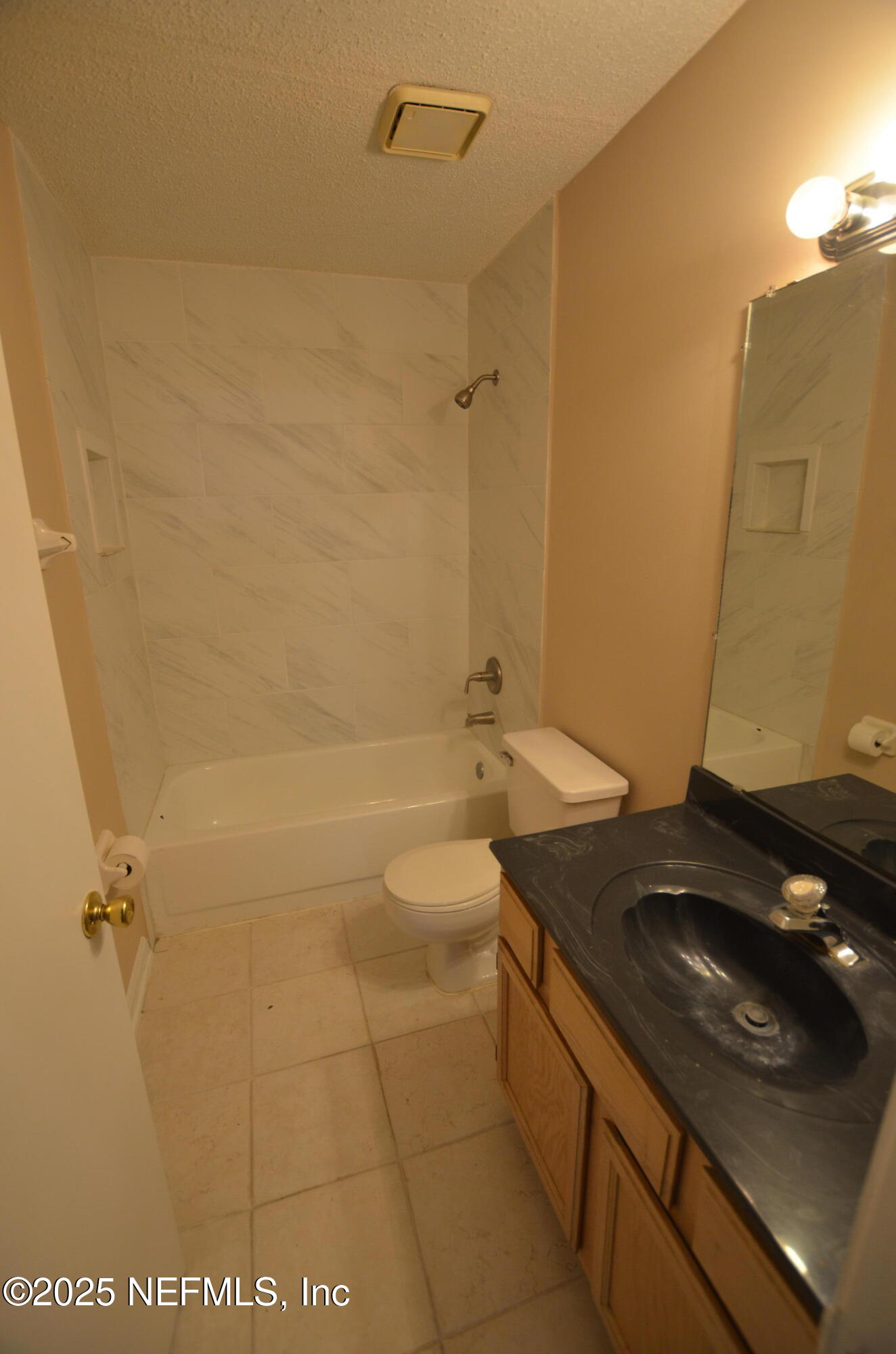 362 Filmore Drive Jacksonville, FL 32225 - Photo 12 of 13 a bathroom with a granite countertop sink a toilet and shower