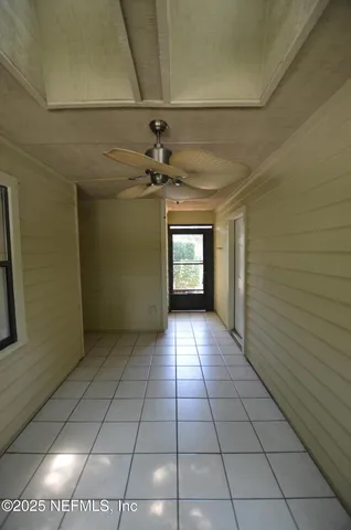 a view of a hallway with a window