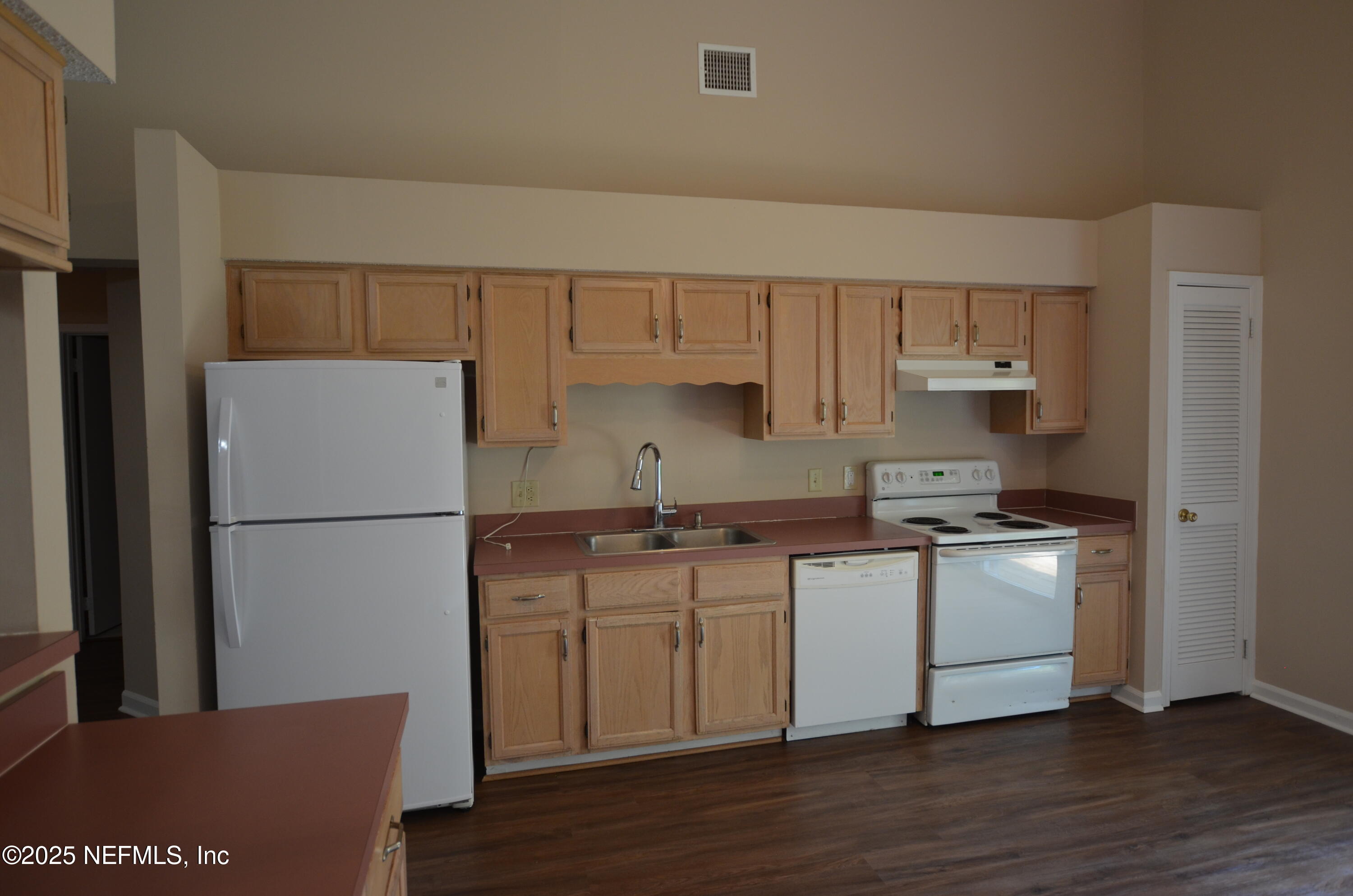 362 Filmore Drive Jacksonville, FL 32225 - Photo 5 of 13 a kitchen with a stove a refrigerator and a sink