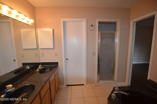a kitchen with a sink and a refrigerator