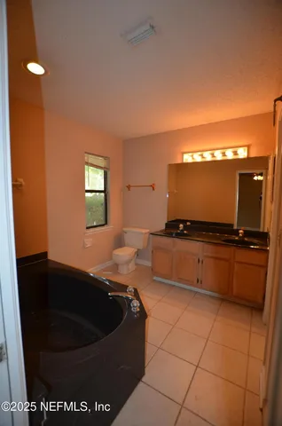 a kitchen with a sink and a stove top oven