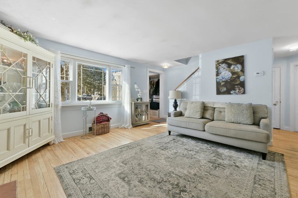 22 Stratford Road Natick, MA 01760 - Photo 11 of 41 a living room with furniture and a large window
