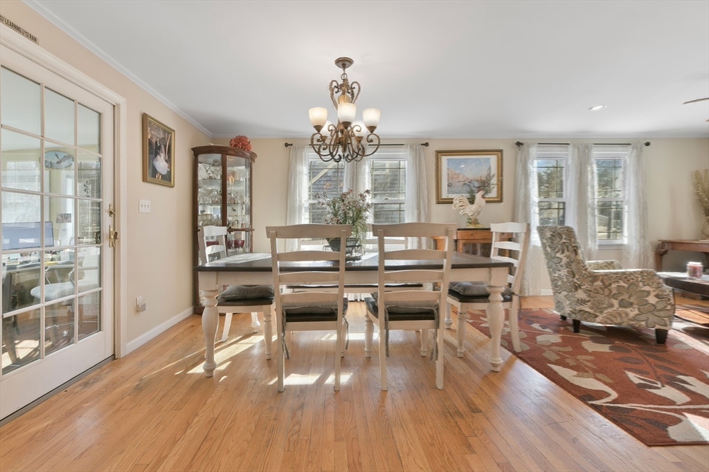 22 Stratford Road Natick, MA 01760 - Photo 16 of 41 a view of a dining room with furniture wooden floor and chandelier