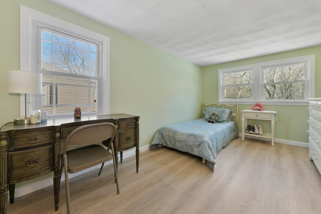 22 Stratford Road Natick, MA 01760 - Photo 25 of 41 a bedroom with a bed and a desk