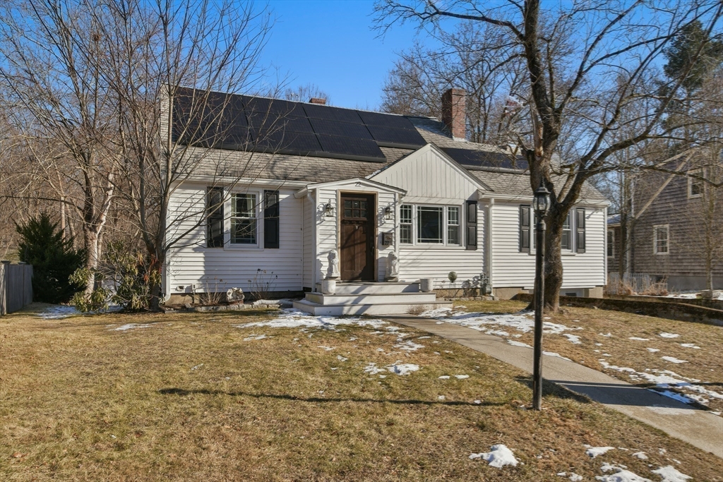 22 Stratford Road Natick, MA 01760 - Photo 5 of 41 a front view of a house with a yard