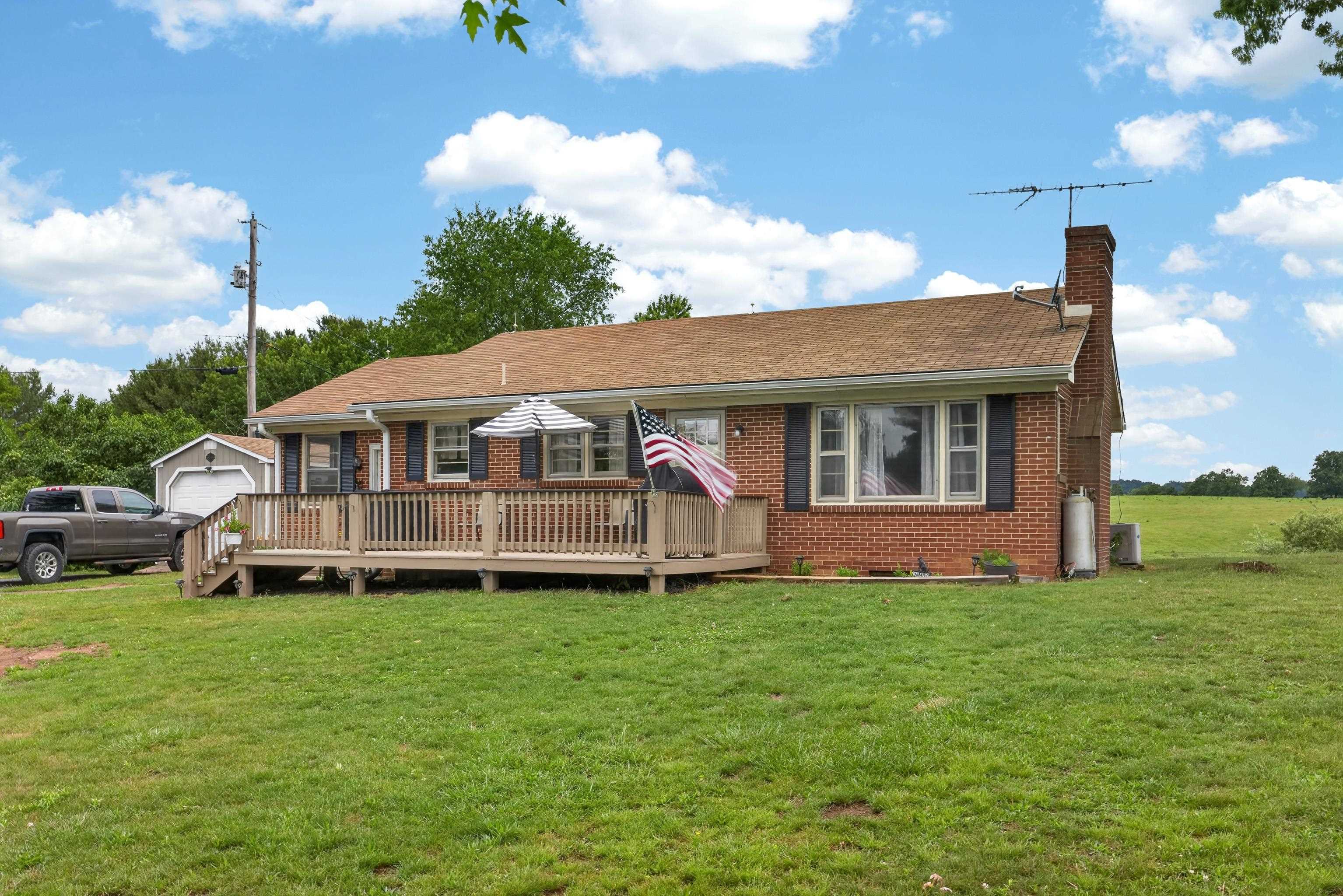 7827 Lee Highway Raphine, VA 24472 - Photo 7 of 62 a view of a house with a yard and sitting area